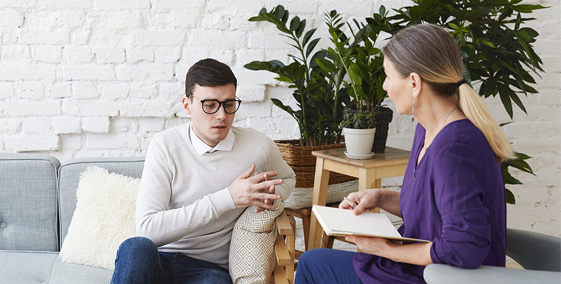 Man talking to female therapist