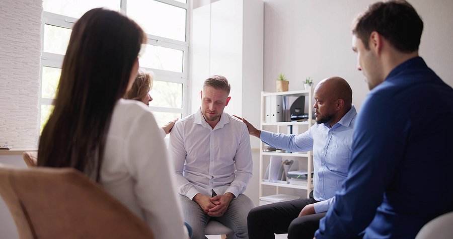 Group Of Diverse Young People Having Conversation about Alcohol Dependency Care