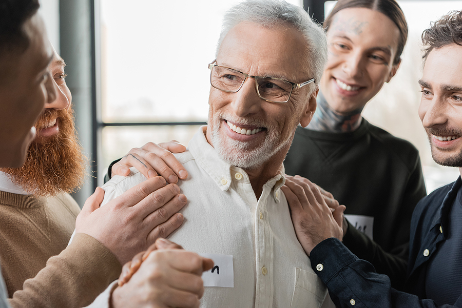 man being congratulated after attending the Special Programs for Opioid Addiction in Rehab Centers